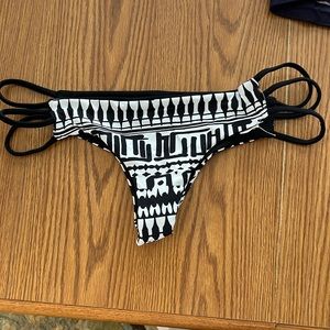 Bikini bottom, reversible can either wear print side out or black side out